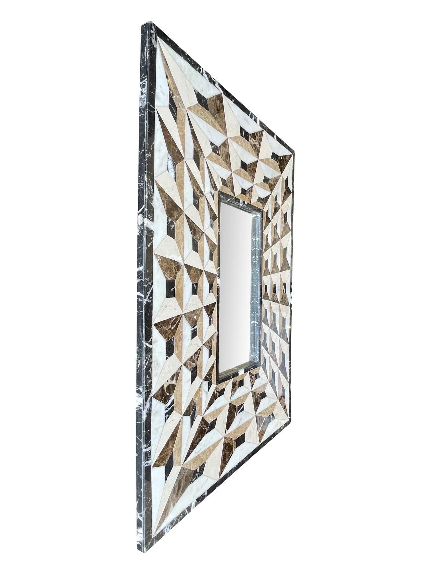 An unusual Art Deco mirror with tessellated marble surround creating an optical perspective. Mirror size inside frame 46cm high x 22.5cm.