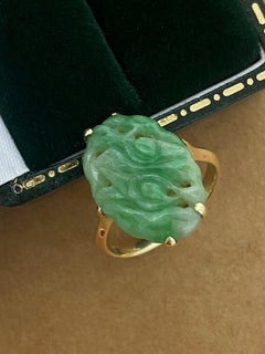 An Art-Deco Natural Green Carved & Pierced Jade (19mm) Ring in 14K Yellow Gold.