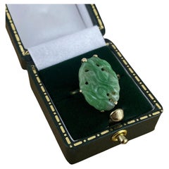 An Art-Deco Natural Green Carved & Pierced Jade (19mm) Ring in 14K Yellow Gold.