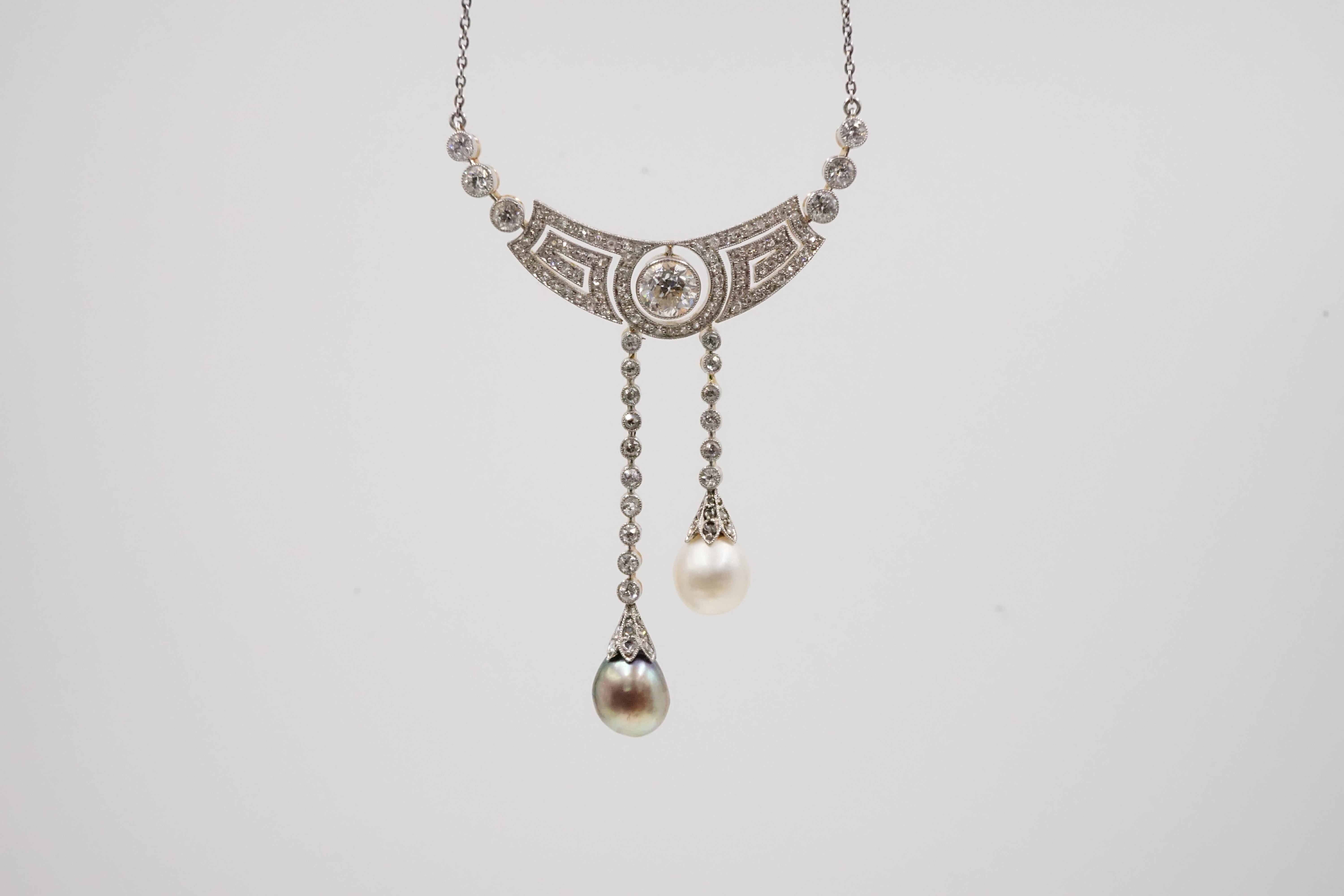 An Art Deco Natural Pearl and Diamond Necklace with cert and Original Box.

Platinum on gold, engravings on the side of this piece shows the attention to details when designing it. company E. Netter & Cie., Hof Juweliere, Mannheim (E. Netter & Cie.,