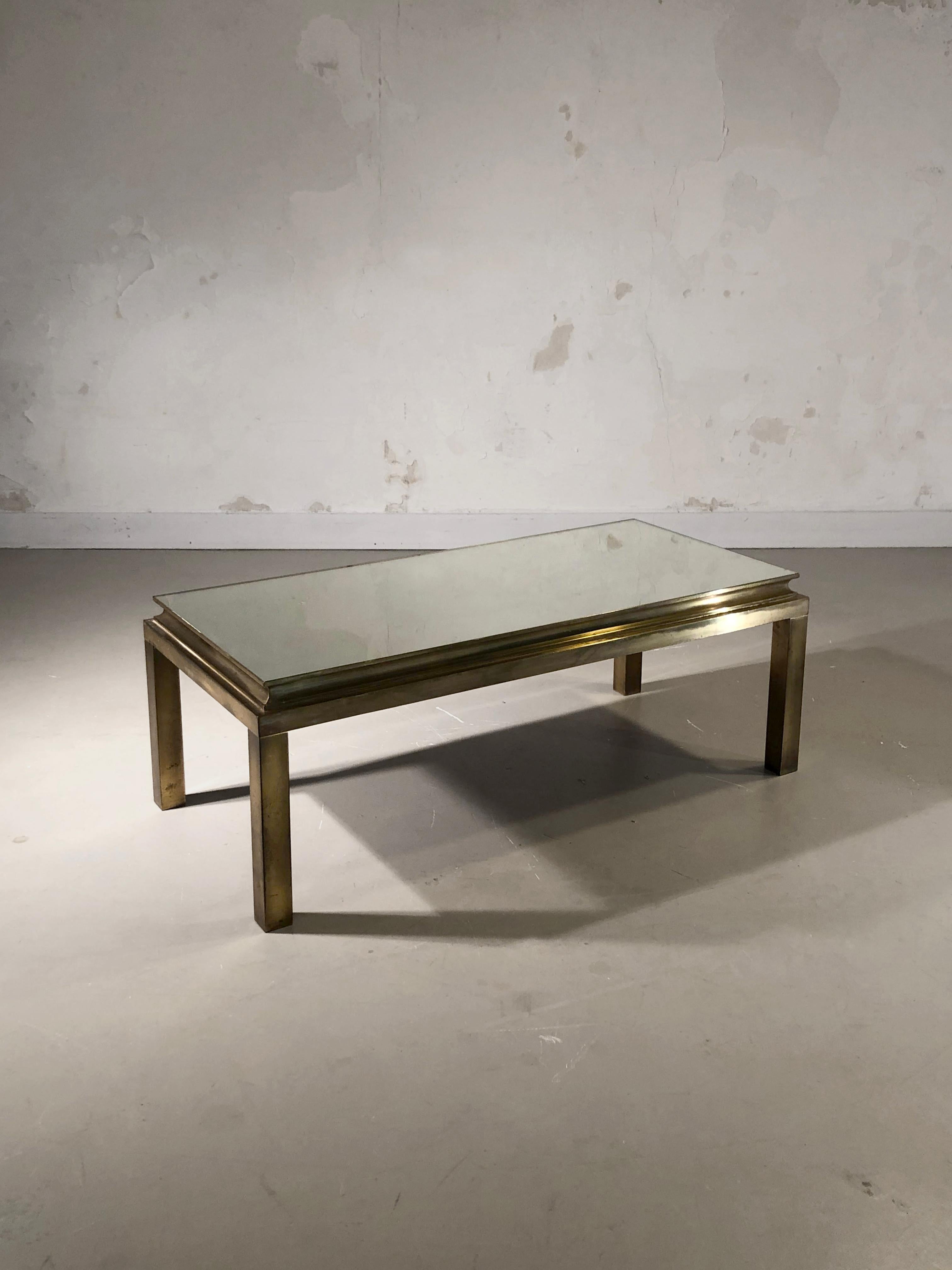 An elegant and luxurious rectangular coffee table, Art-Deco, Post-Modernist, Neo-Classical, square section base and stepped ornament supporting an old mercury mirror glass top, Maison Jansen, France 1970.