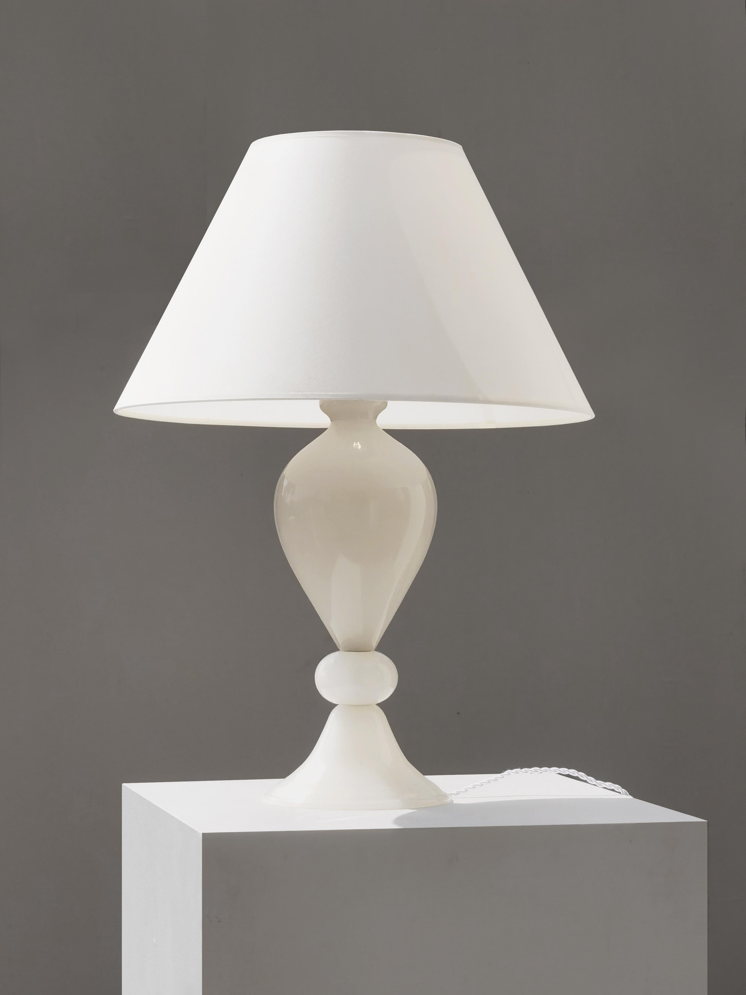 An important, elegant, luxurious table lamp, Art-Deco, Neo-Classical, Shabby-Chic, composition of 3 generous and sensual pieces of milky white thick blown glass, by yet anonymous artist and manufacture, Italy 1970.
This is a 