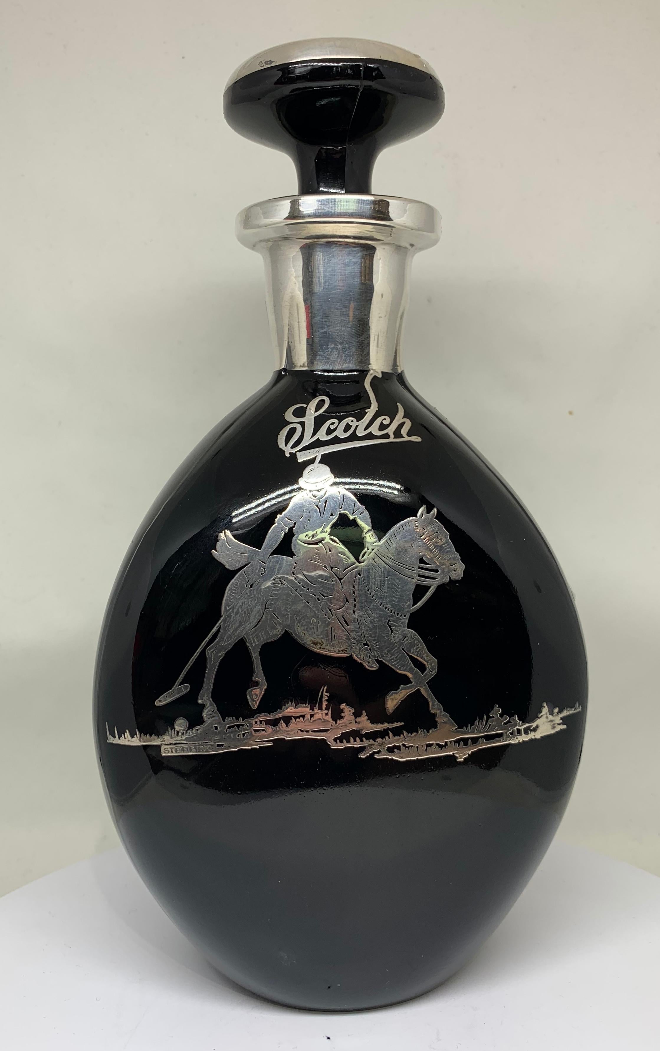 A rare and unusual Polo themed Obsidian glass and inlaid sterling silver Scotch decanter, American, circa 1930s.

Having a triangular 