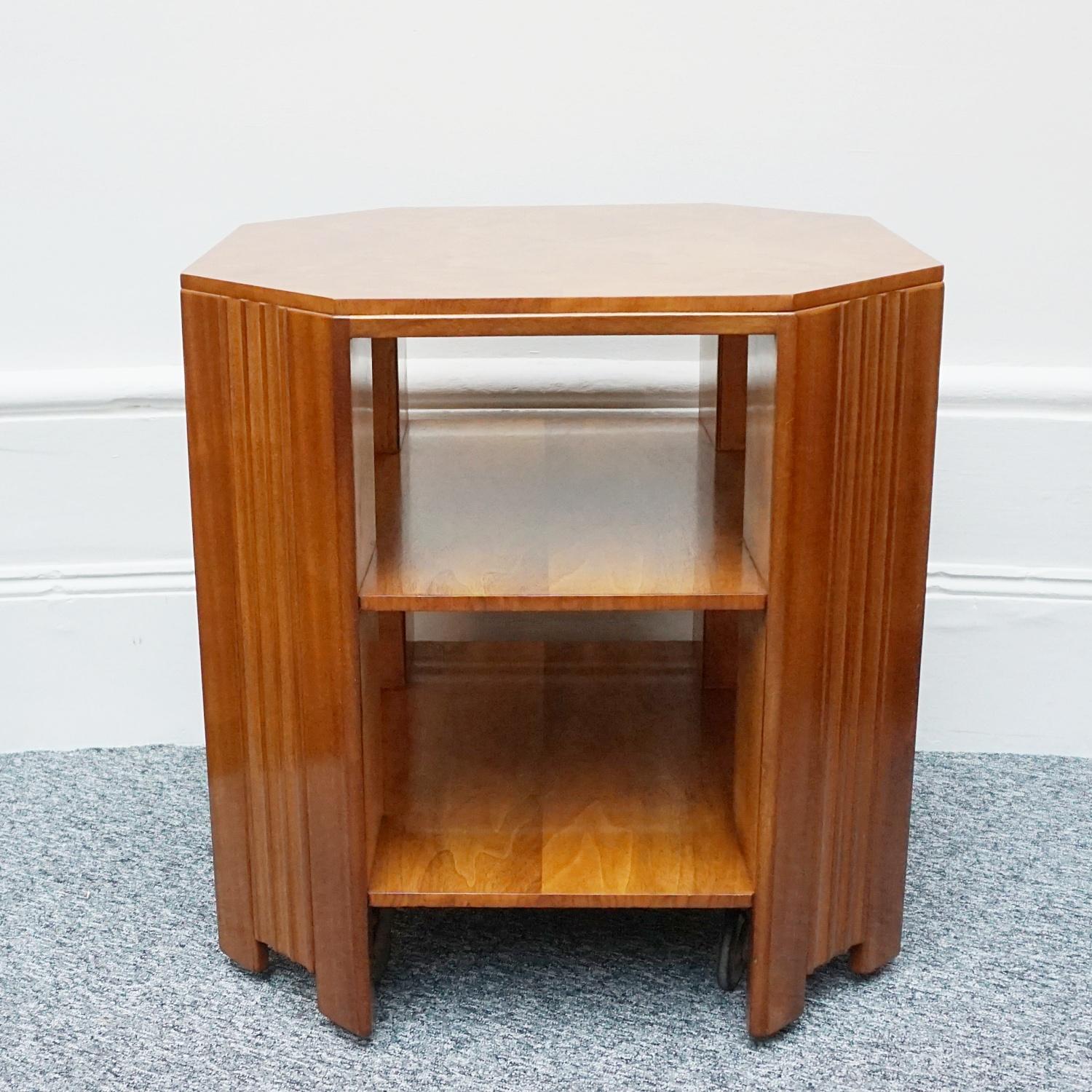 An Art Deco octagonal side table by Waring & Gillow. Walnut veneered with open two tiered shelving. Waring and Gillow Ltd label to underneath 

Origin: English

Date: circa 1935

Item Number: 2103233

All of our furniture is extensively