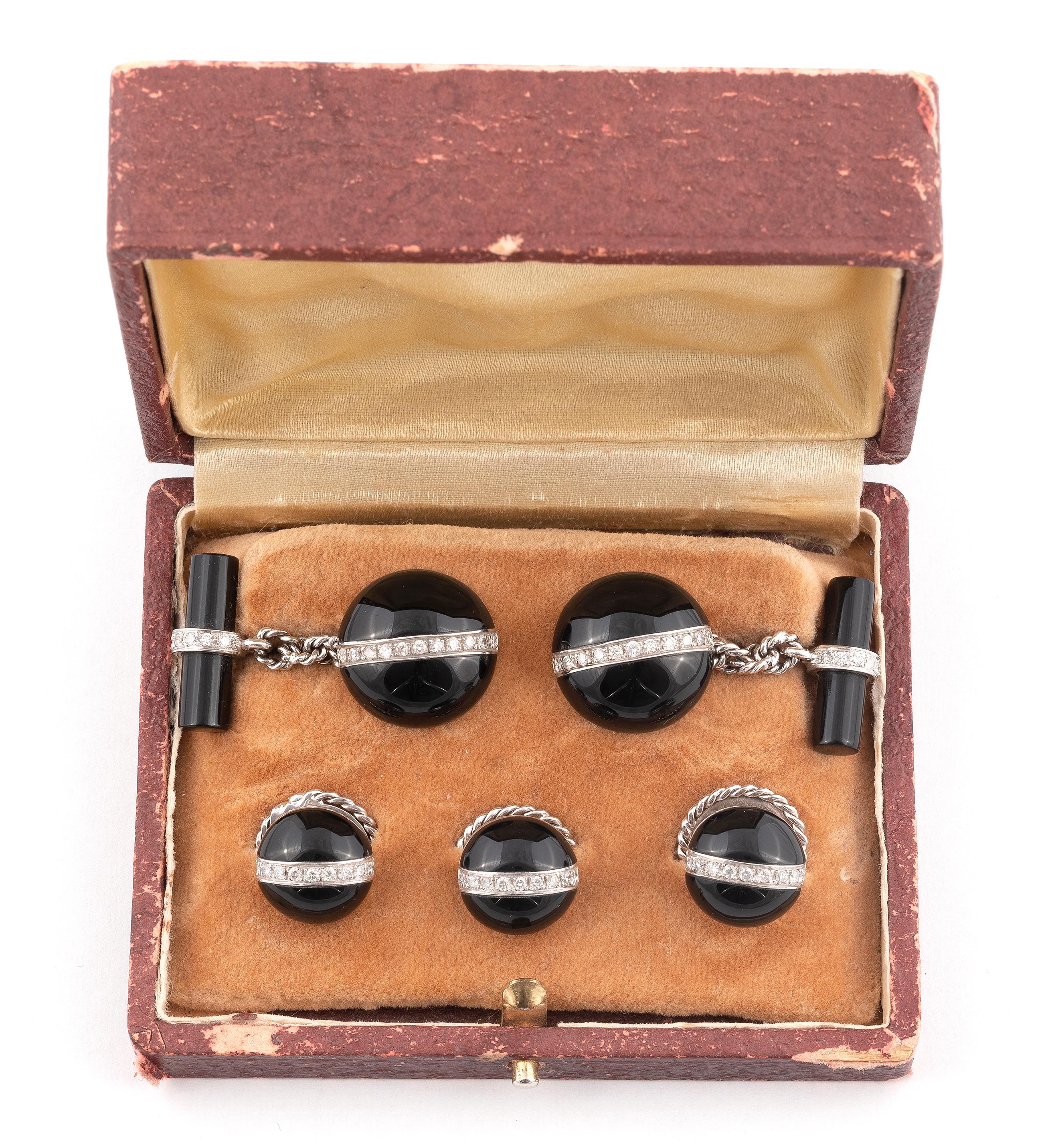 
Each cufflink of circular design with central diamond line detail, three buttons en suite, circa 1950, in beige filt fitted case.