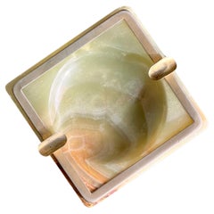 An art deco onyx ashtray with brass insert, 20th century