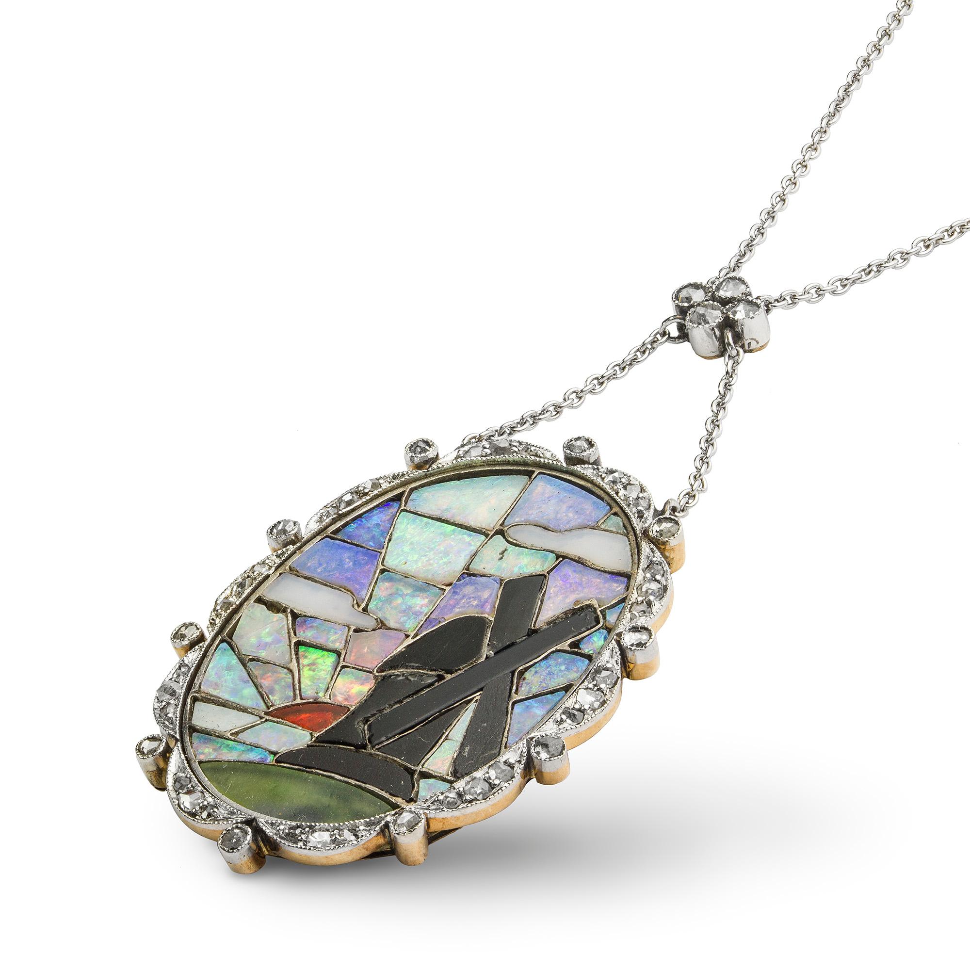 An Art Deco opal and diamond pendant, the oval panel with opal, onyx and hardstone mosaic depicting the silhouette of a windmill at sunset, within a delicately scalloped rose-cut diamond set border, suspended from a fine platinum chain with rose-cut