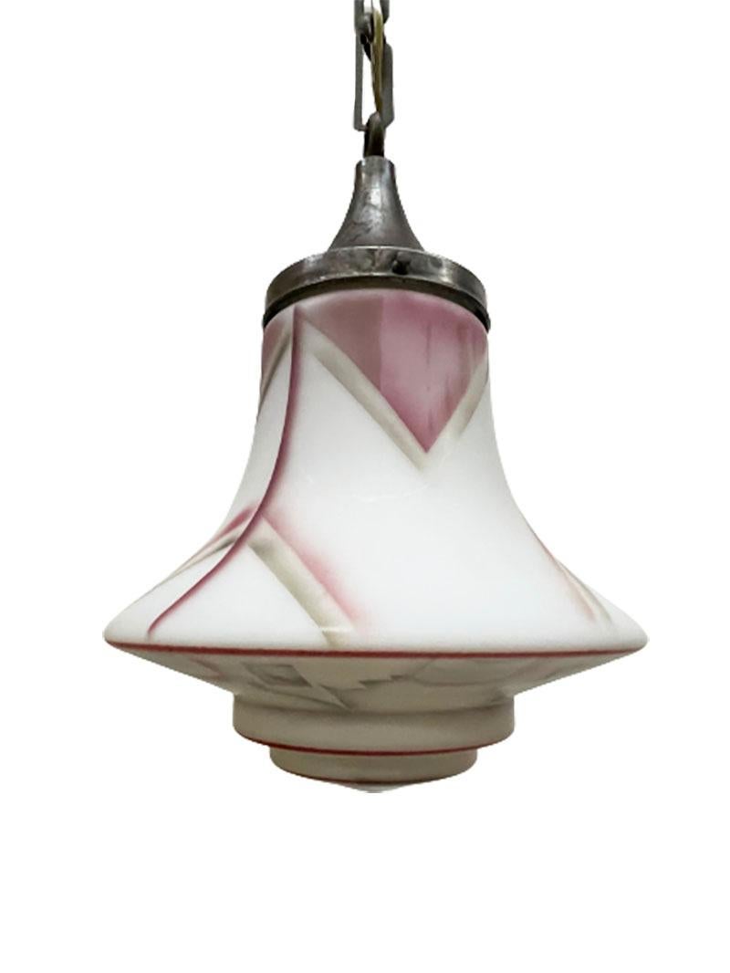 An Art Deco painted milk glass pendant lamp, 1920s

A pendant lamp with hand-painted milk glass in Art Deco, 1920-1930. 
The length on the chain is 67 cm. 
The lampshade is 24 cm high and 22 cm diagonal.