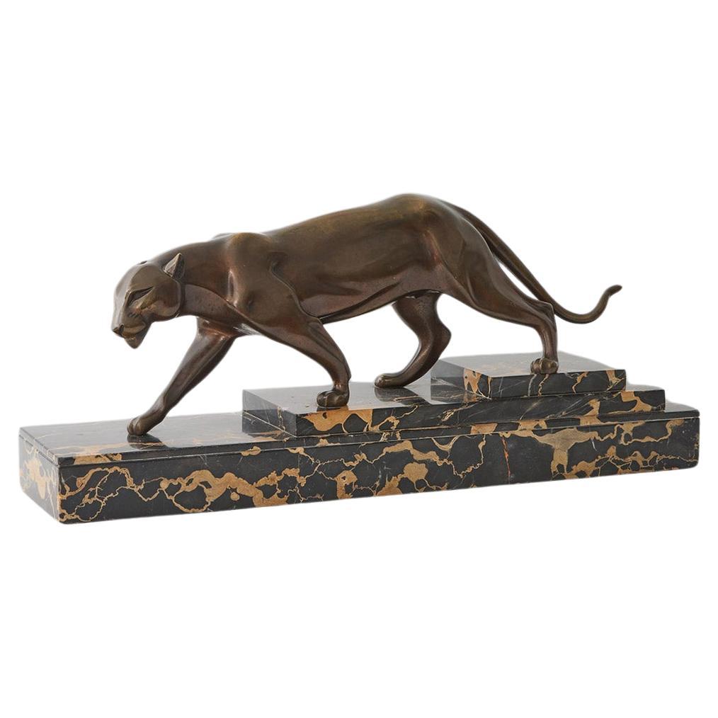 An Art Deco patinated bronze study of a prowling panther by Henri Molins