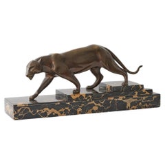 An Art Deco patinated bronze study of a prowling panther by Henri Molins