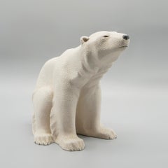 An Art Deco patinated ceramic seated polar bear by Sevres Vinsare France