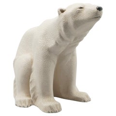 An Art Deco patinated ceramic seated polar bear by Sevres Vinsare France