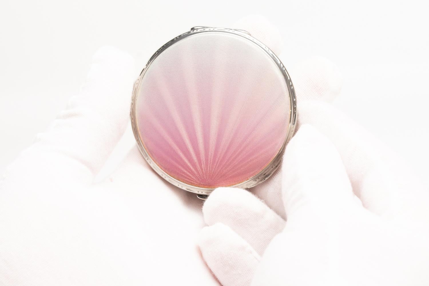 This rare and gorgeous Art Deco Solid Silver & Pink Guilloche Enamel Round Powder Compact was made by Crisford & Norris in Birmingham 1938. This exquisite piece is decorated with two guilloche enamel colours: pale pink and pearl white with a