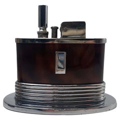 An Art Deco Ronson Oval Touch Tip Table Lighter With A Tortoise Shell Finish