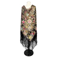 An Art Deco shawl embroidered with flowers on black tulle, circa 1920