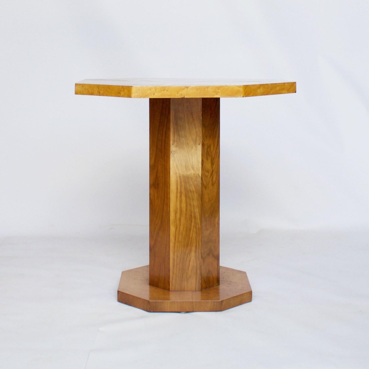 An Art Deco side table with a bird's-eye maple tabletop and base connected by a burr walnut octagonal stem. 

Dimensions: H 98cm W 48cm W/D 46cm base W/D 36cm

Origin: English

Date: circa 1930

Item Number: 2907202

All of our furniture is