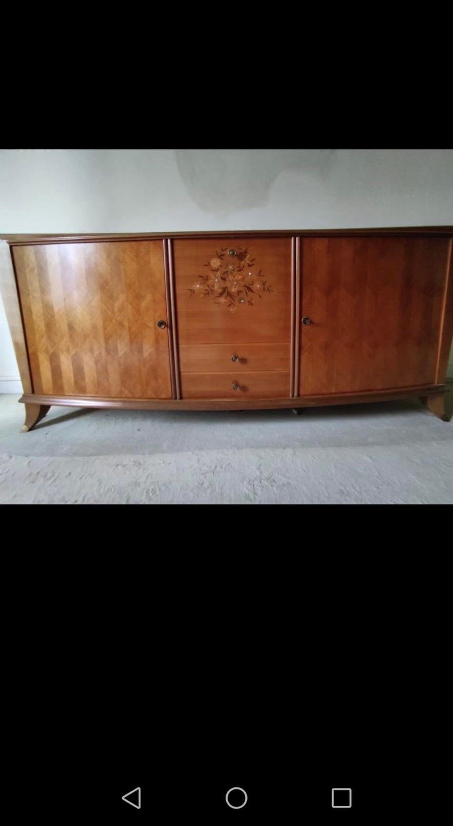 a 1930 sideboard in walnut inside in sycomore attributed to Leleu