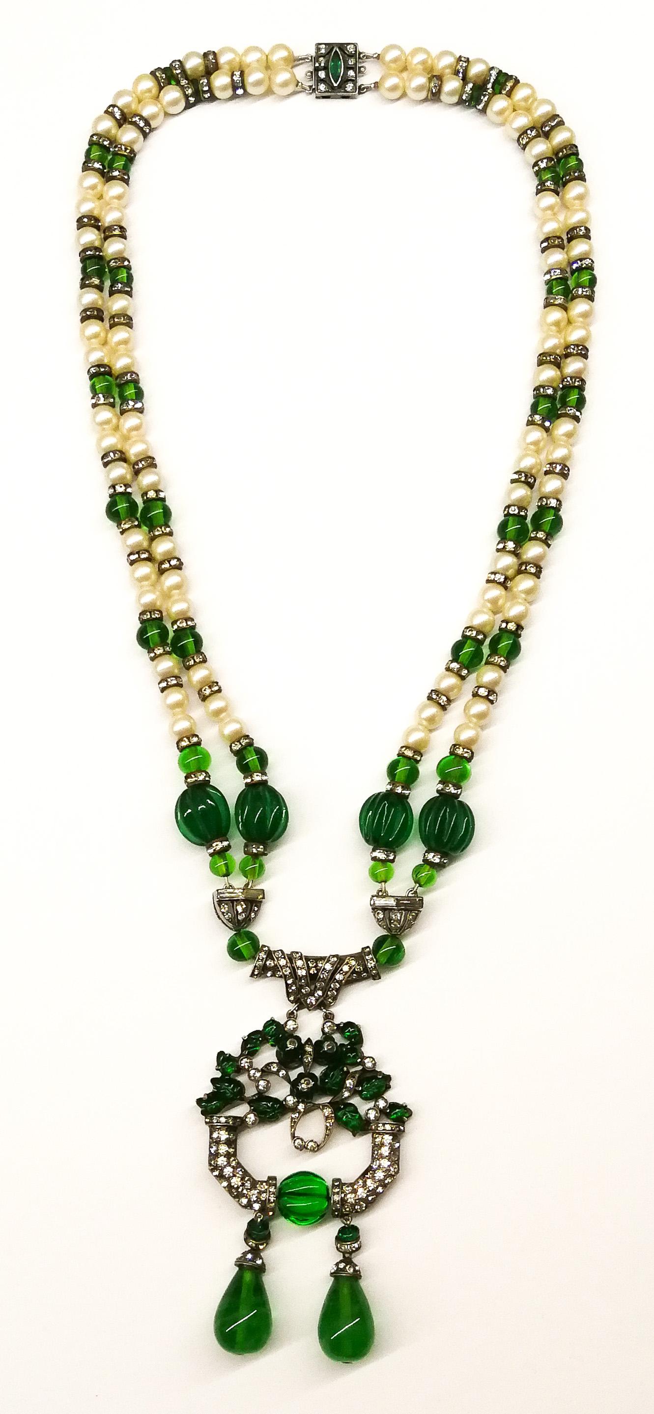 A stunning 1920s Cartier-style sautoir, made from emerald glass, paste pearls and clear pastes, all set in silver, highly typical of the Art Deco period. Both the centrepiece and clasp bear the French hallmark for silver (as shown in two detailed