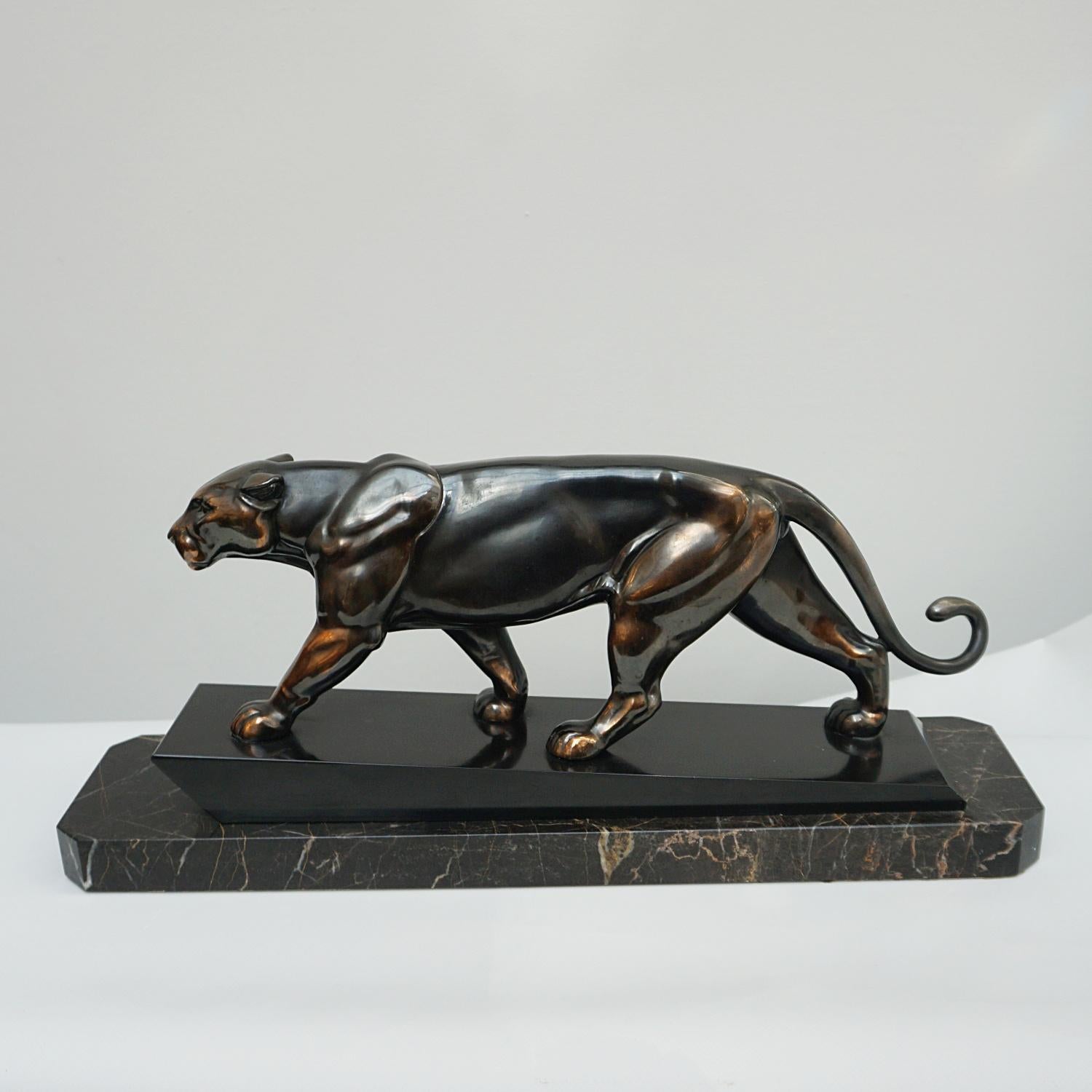 An Art Deco spelter sculpture of a stalking panther by Irénée Rochard. Set over a marble base. 

Origin: French 

Date: Circa, 1930

