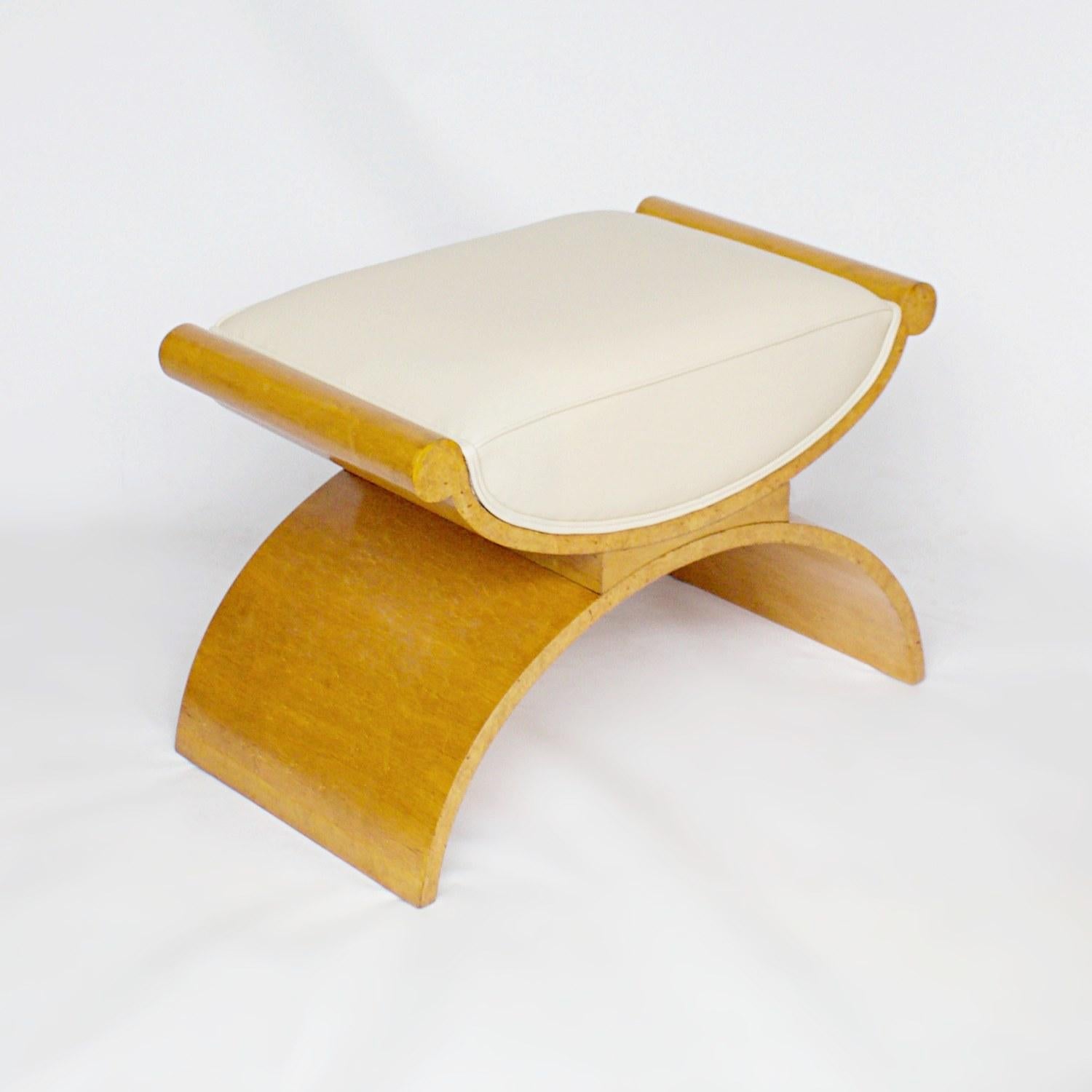 An Art Deco C-frame stool by Harry & Lou Epstein. Satin birch and bleached walnut veneered, upholstered in cream leather.

Dimensions: H 51cm, W 70cm, D 41cm, Seat H 49cm

Origin: English

Date: circa 1930

Item No: 1611201

All of our