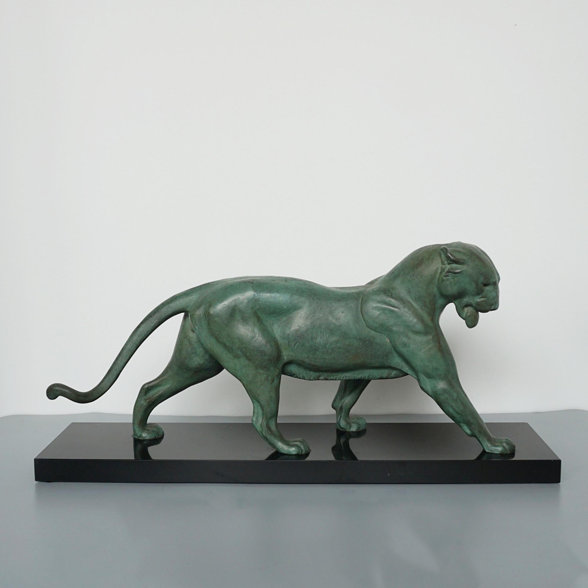 A large Art Deco spelter study of a striding panther by Plagnet. Set over original marble base and signed 'Plagnet' to base.