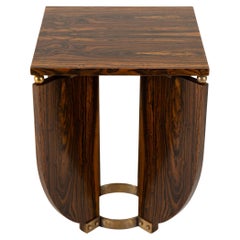An Art Deco Style End Table With a Brass Base