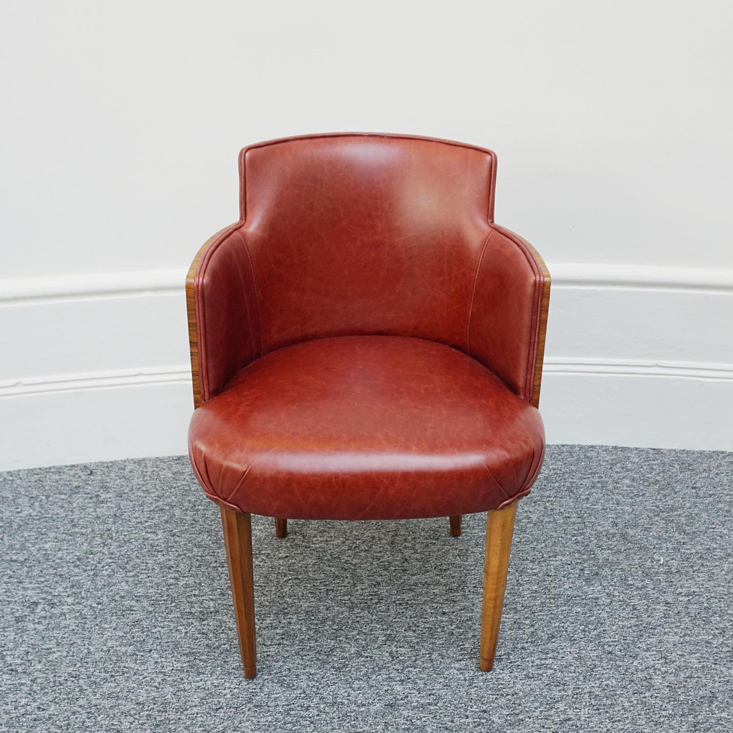 An Art Deco Tub Chair. Walnut veneered with solid walnut legs. Re-upholstered in red leather. 

Dimensions: H 80cm W 54cm D 46cm Seat H 46cm

Origin: English

Date: Circa 1935

Item Number: 3005232

All of our furniture is extensively