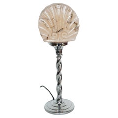 An Art Deco Twisted Chromed Metal and Marbled Glass Table Lamp