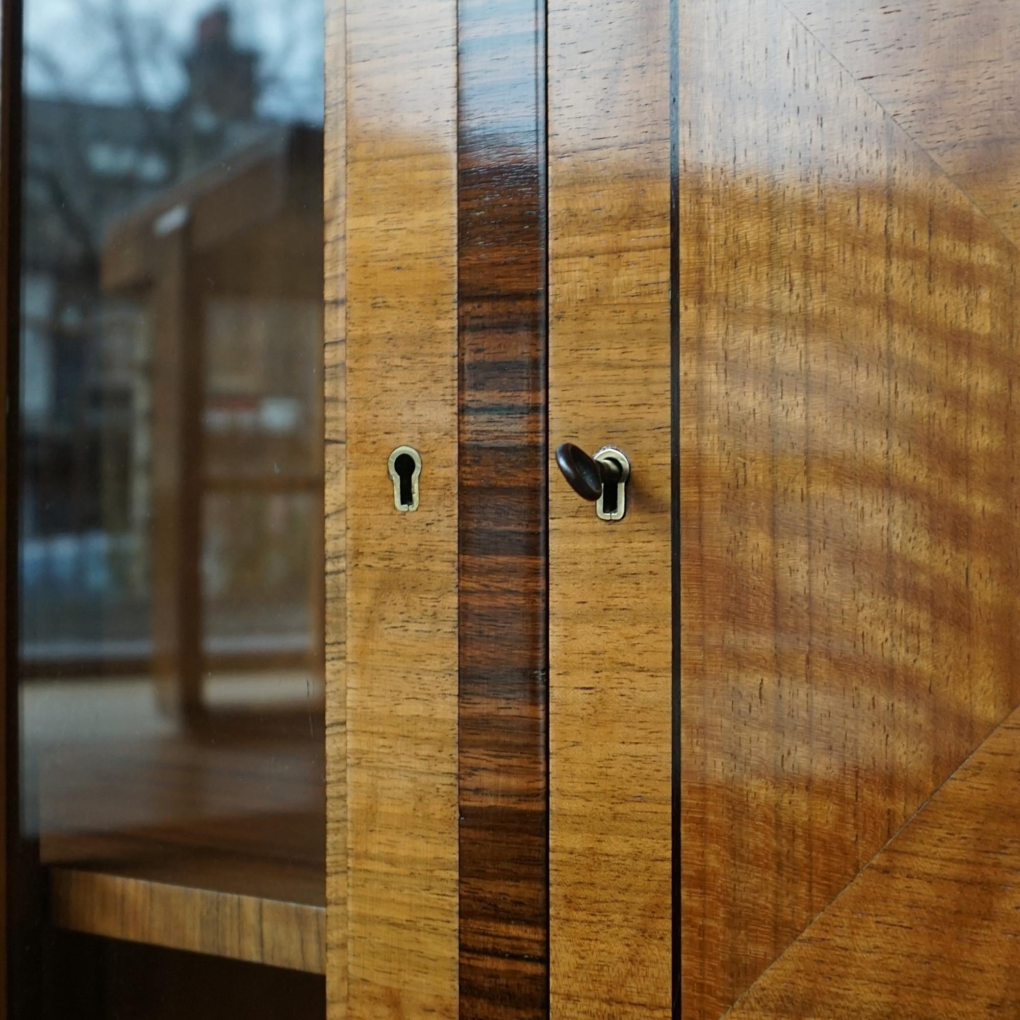 English An Art Deco Walnut and Macassar Ebony Cabinet by Heal's of London