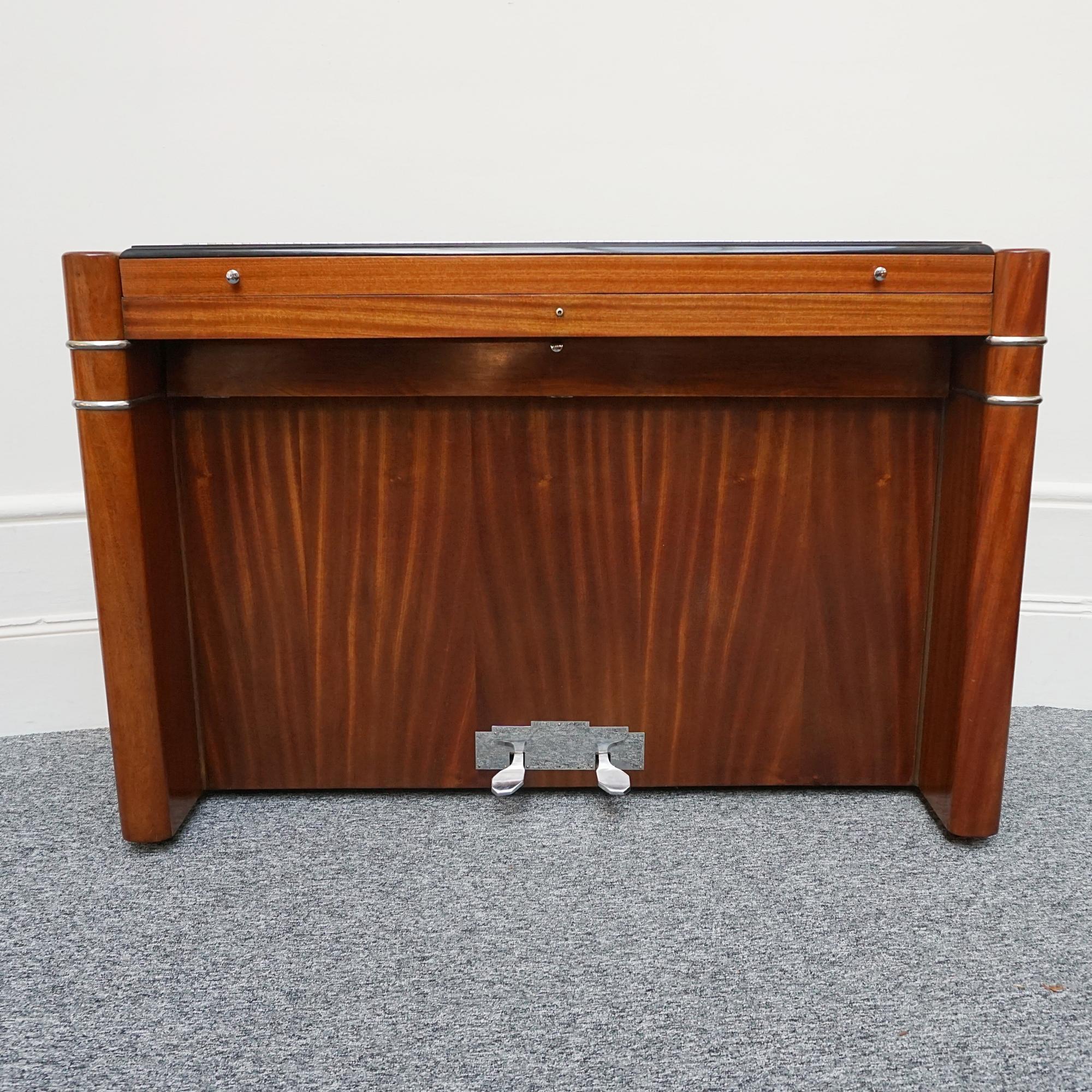 AN Art Deco mini 'Pianette' and stool by Eavestaff. Veneered walnut throughout with ebonised banding. Stool with integral sheet music compartment.

Dimensions: H 81cm W 130cm D 46cm

Origin: English

Date; Circa 1935

Item Number: 27102314

All of