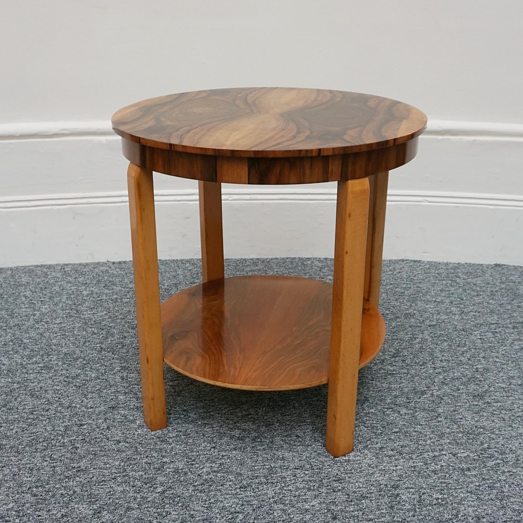 An Art Deco rounded two tiered side table. Burr walnut with figured walnut and solid walnut legs.

Dimensions: H 61cm W/D: 60cm

Origin: English

Date: Circa 1935

Item Number: 1011235

 All of our furniture is extensively polished and restored