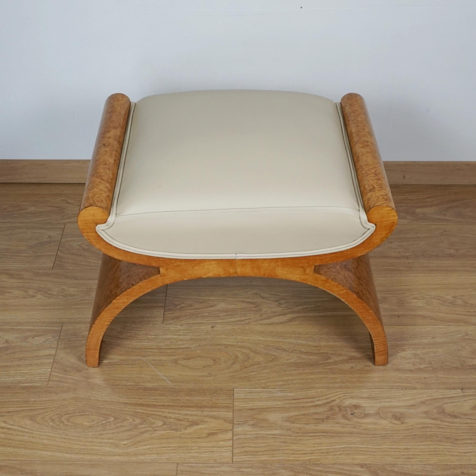 An Art Deco X-Frame stool by Harry & Lou Epstein. Burr walnut and satin birch banding with cream leather re-upholstery. 

Dimensions: H 48cm W 72cm D 43cm

All of our furniture is extensively polished and restored where necessary to the highest