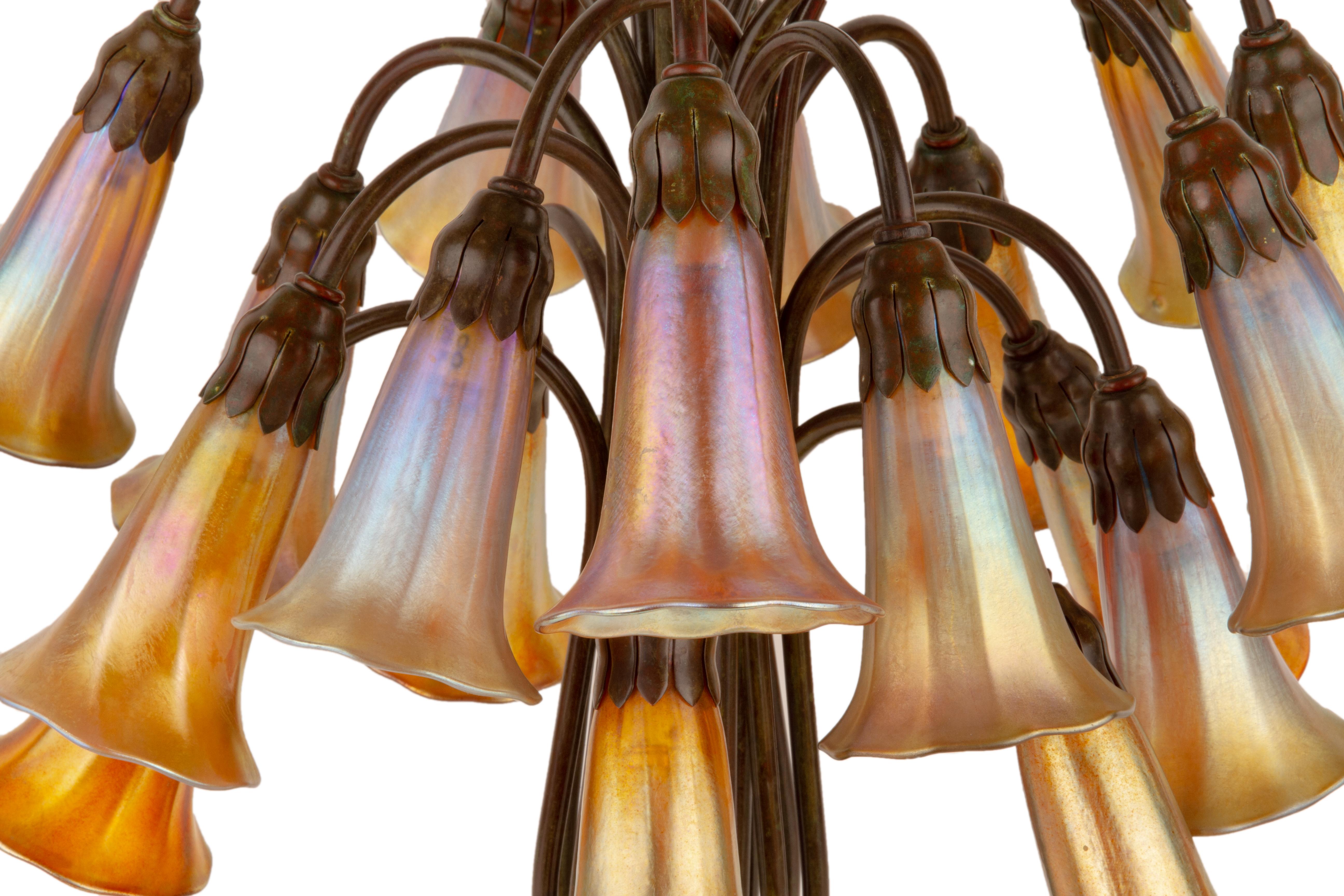 An American Art Nouveau patinated bronze and favrile 