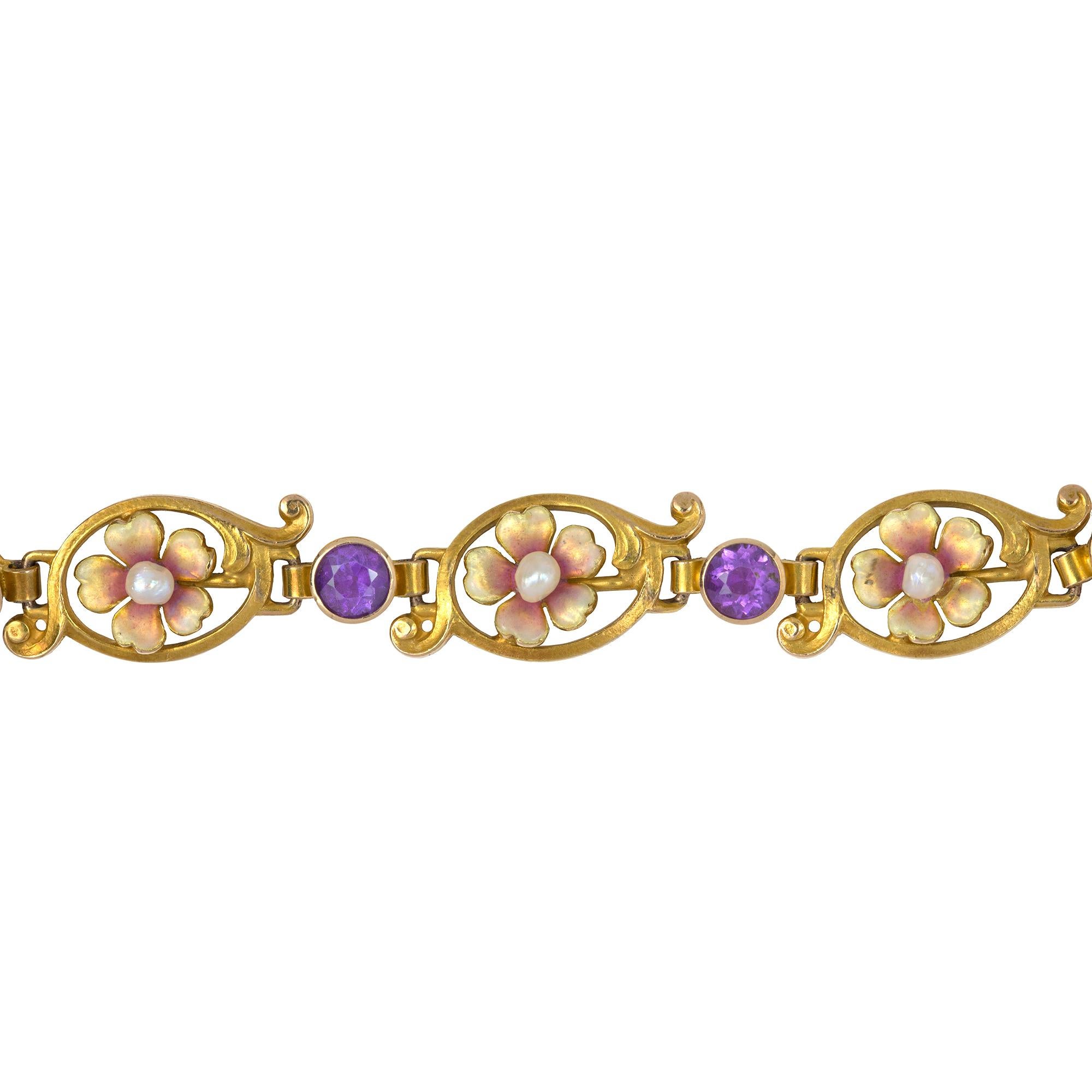 An Art Nouveau gold, enamel and amethyst flower bracelet, each link comprising a golden and pink enamel flower, set to the centre with a pearl, the flower set to the centre of an oval-shaped yellow gold scroll, each plaque linked by a yellow gold