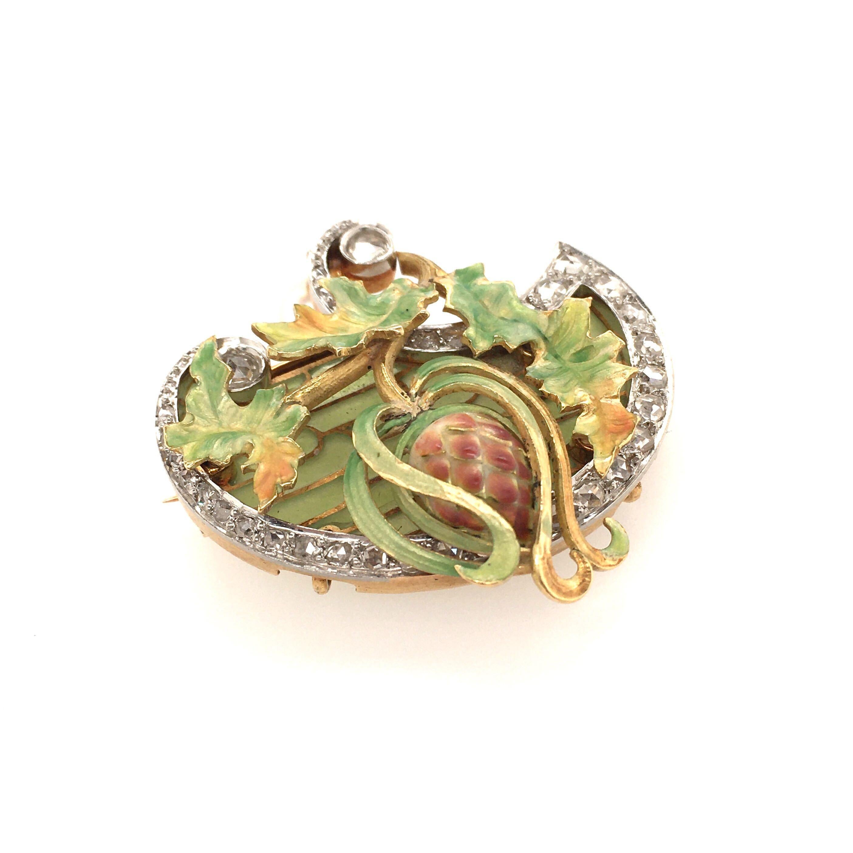 An Art Nouveau 18 karat yellow gold, enamel and pearl brooch. Circa 1900. Designed as a green, yellow and orange enamel foliate spray, against a green plique a jour background, suspending a creamy white drop shaped pearl, measuring approximately