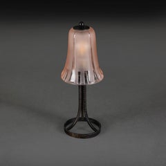 An Art Nouveau Lamp with a Pink Glass Shade