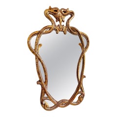 Specchio Art Nouveau con cornice in legno dorato e argentato. Francese, 1910 ca.
