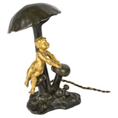 An Art Nouveau Ormolu Lamp with a Baby, Circa 1900.