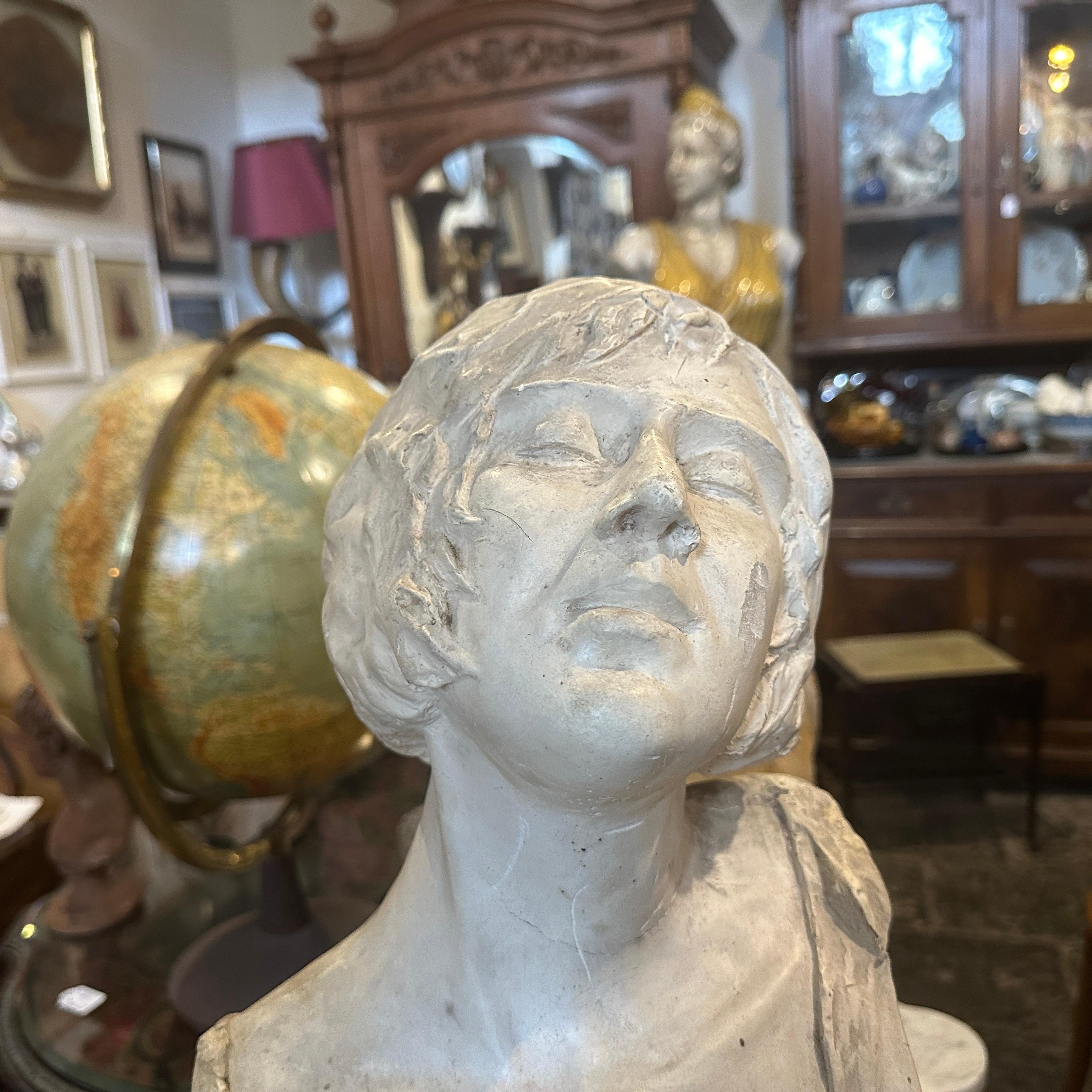 This Italian sculpture fits within the tradition of capturing feminine beauty in a romanticized manner, emphasizing elegance and emotional expression, it shows a woman in a serene or perhaps expressive posture, her head tilted back with her eyes