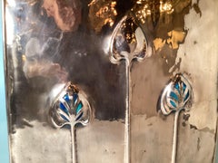 An Art Nouveau Polished Copper Fire Screen with Glass Inserts