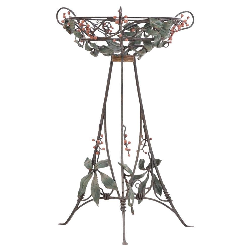 An Art Nouveau style iron plant stand, C. 1950.