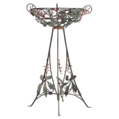 An Art Nouveau style iron plant stand, C. 1950.