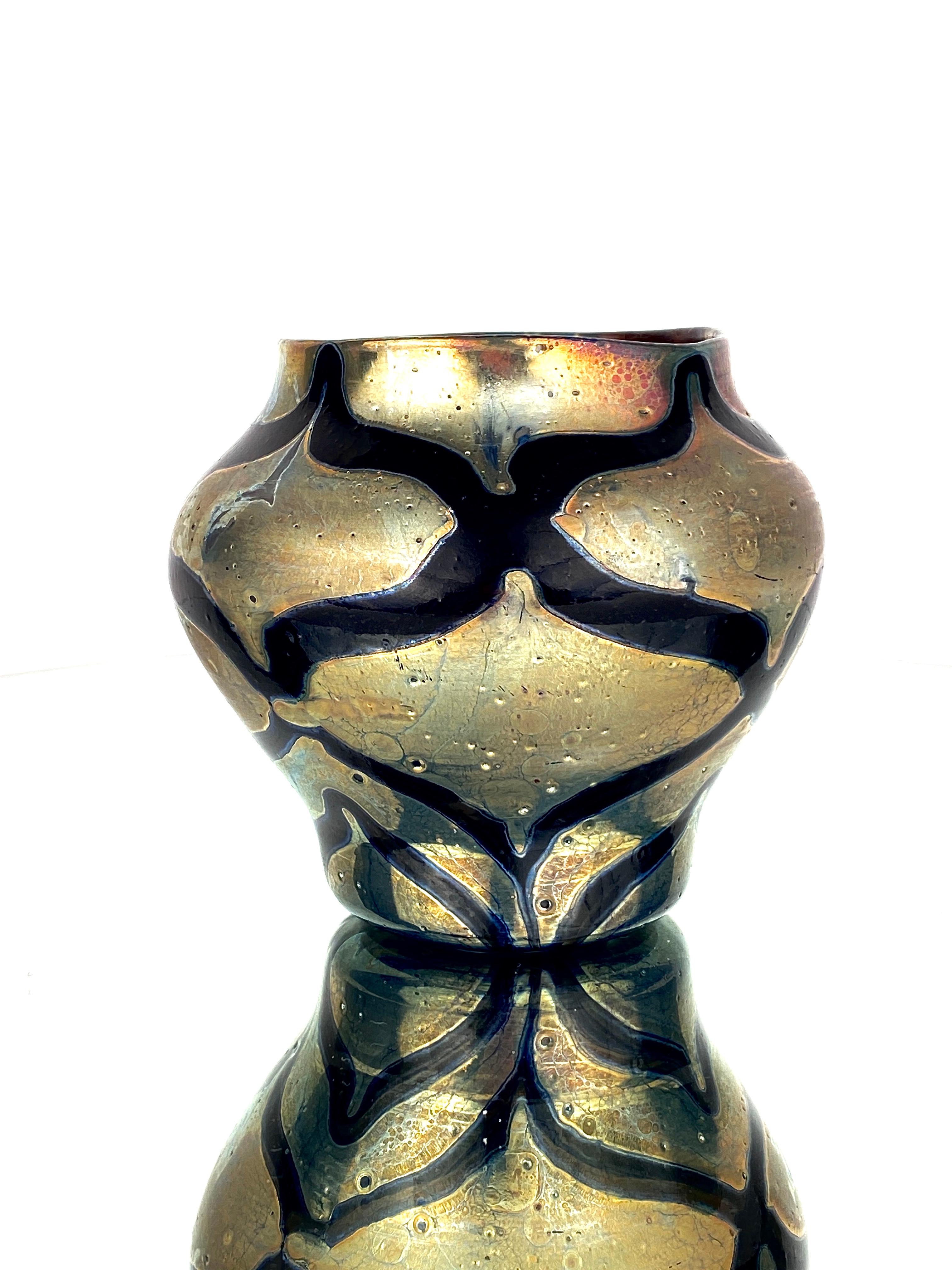 An American Art Nouveau blown glass Tiffany Favrile decorated Cypriote vase by, Tiffany Studios decorated with a black-blue iridescent zig-zag pattern against an iridescent 