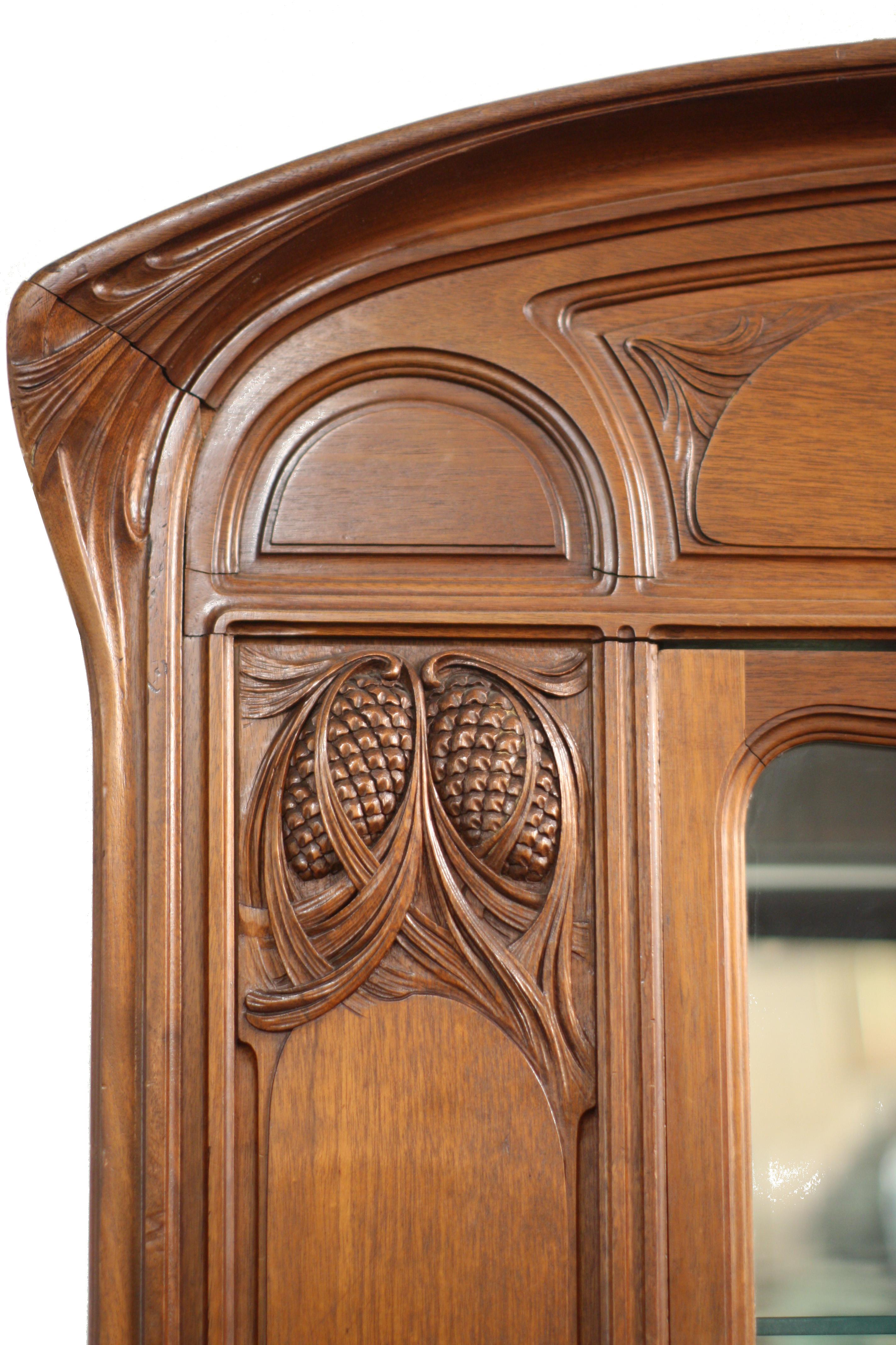An Art-Nouveau Vienna Secessionist rosewood cabinet, stylized brass pull and keyhole cover.
Measures: Height 90 in. (228.60 cm.), 
Width 51.25 in. (130.17 cm.), 
Depth 20.5 in. (52.07 cm.).
 