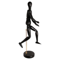 An articulated carved ebonized oak wood artist dummy, France 1920.