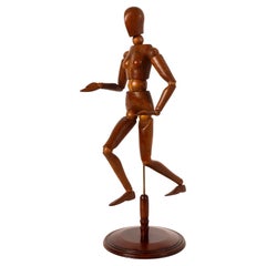 An articulated female artist model, walnut and maple wood, France 1920.