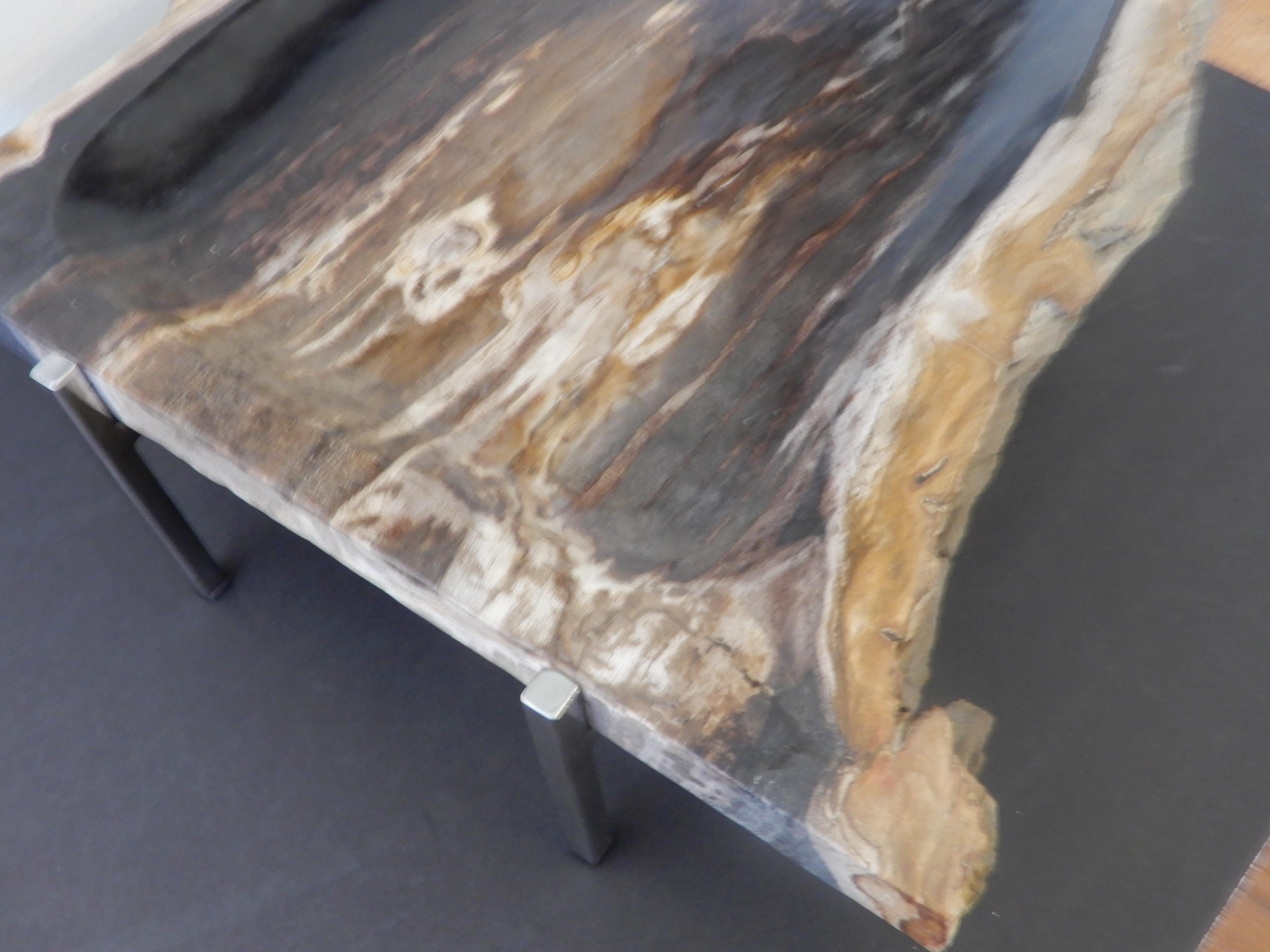 An Artisan crafted Petrified wood and chrome base serving platter or centerpiece, food safe. Natural free edge form.
Black and light woods thousands of years old(petrified) sealed.
