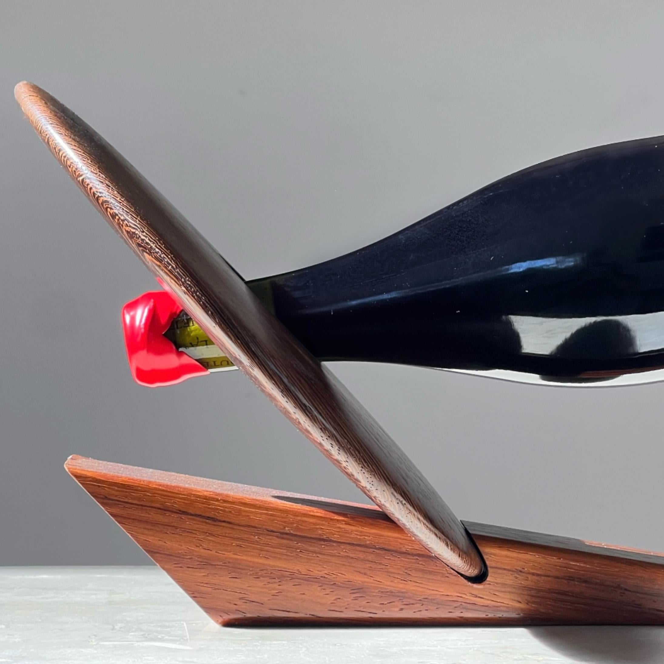 An artist-made Danish mid century teak wine holder, signed, mid 20th century 3