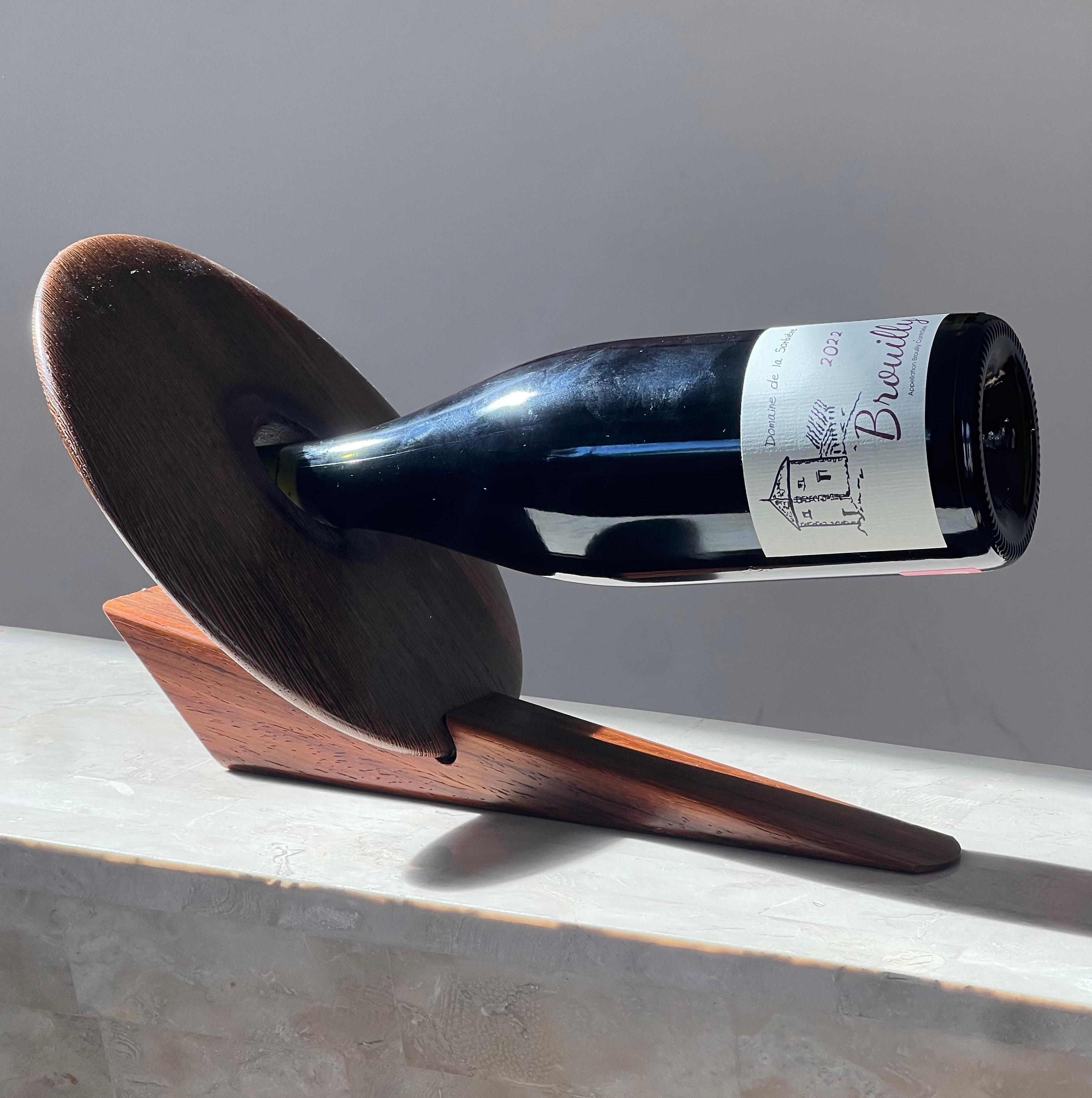 An artist-made Danish mid century teak wine holder, signed, mid 20th century 5