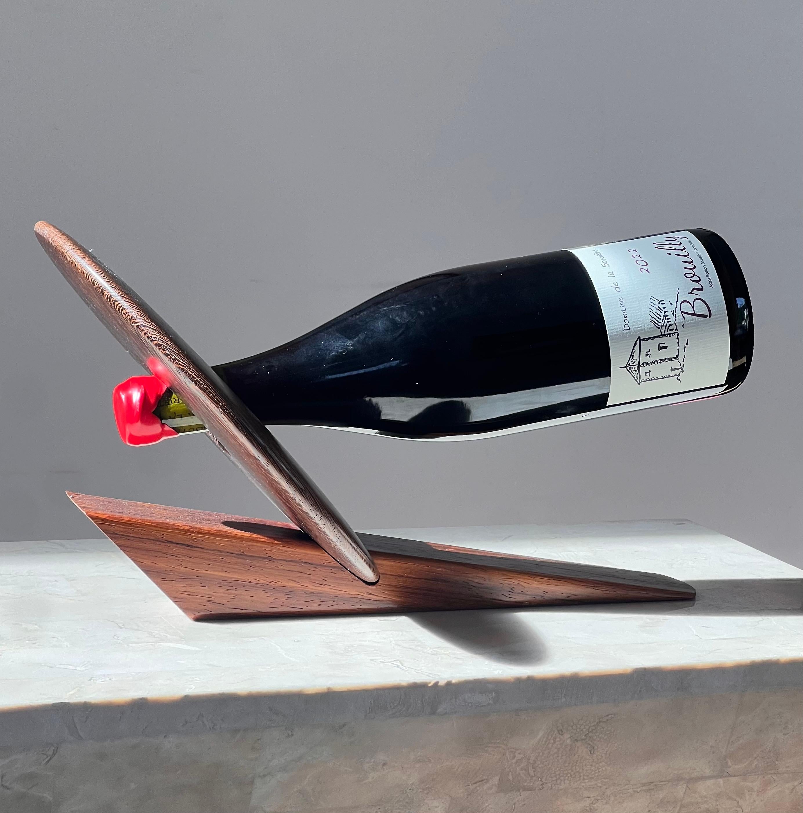 An artist-made Danish mid century teak wine holder, signed, mid 20th century 6